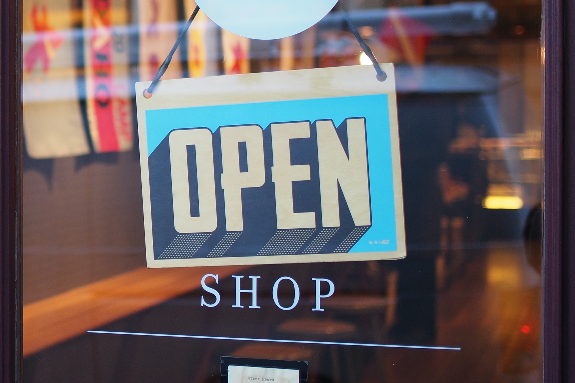 Open shop sign in window