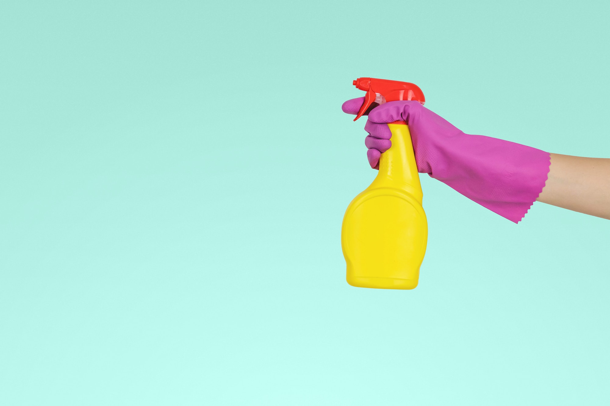 woman using bright cleaning product 